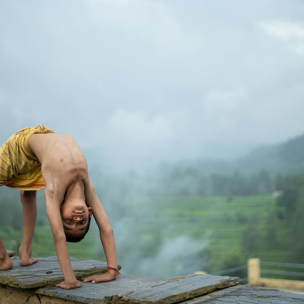 Person meditating peacefully in a lotus position with a serene expression.